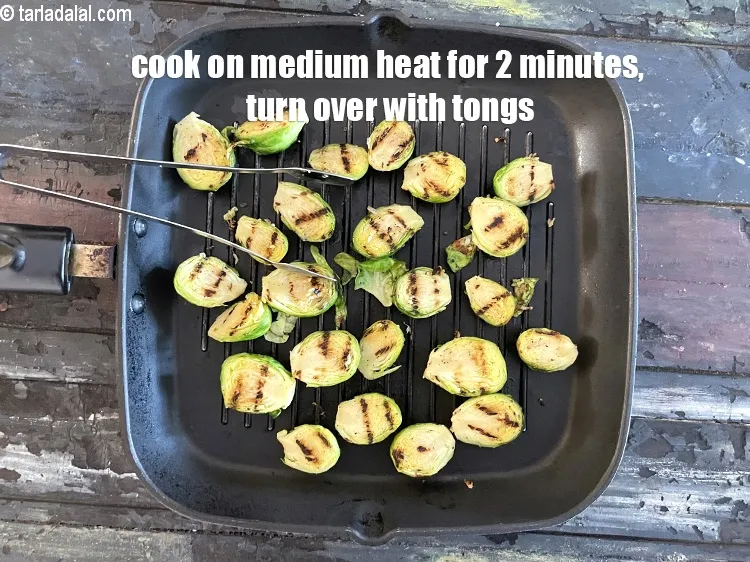 Step 19 – Cook on a medium low flame for 2&nbsp;minutes and flip over using tongs.