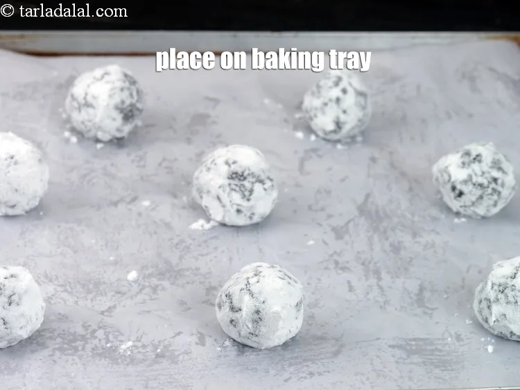 Step 19 – Place them on the baking tray lined with parchment paper. Keep distance between each cookie.