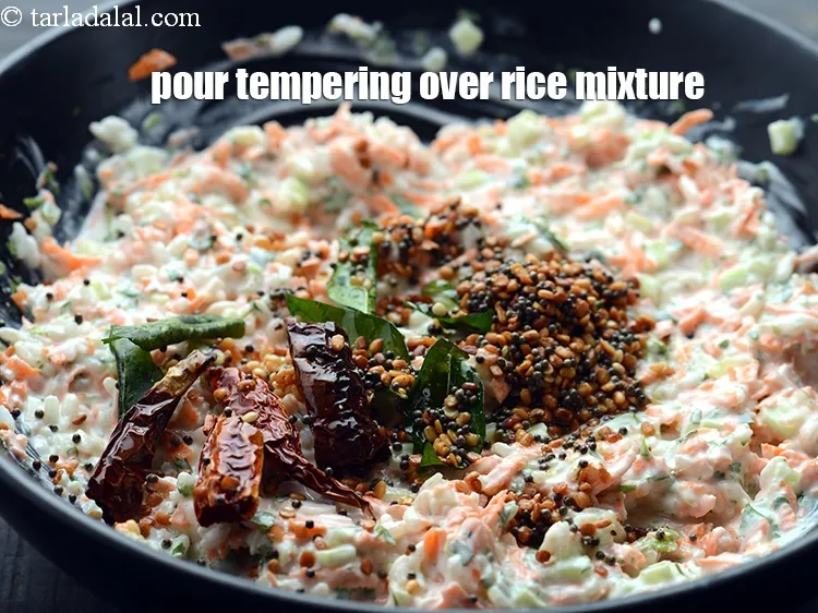 Step 20 – Pour this tempering over the rice mixture and mix well.&nbsp;