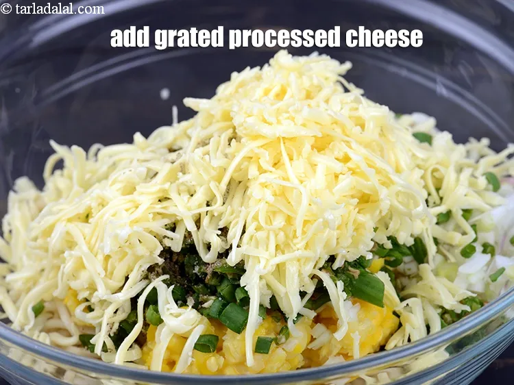Step 20 – Add &frac12; cup <a href="https://www.tarladalal.com/glossary-grated-processed-cheese-868i">grated processed cheese</a>.