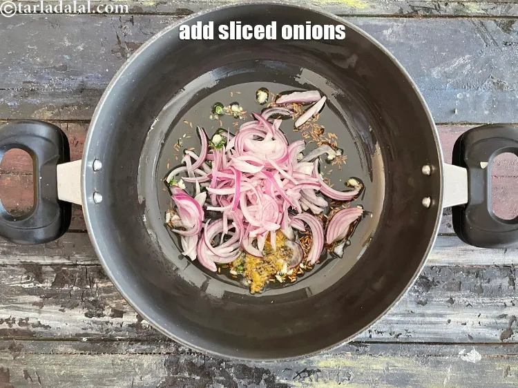 Step 31 – Add&nbsp;<meta charset="UTF-8" />3/4 cup&nbsp;<a href="glossary-sliced-onions-745i">sliced onions</a>.