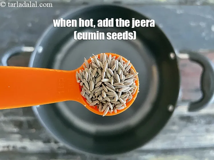 Step 19 – When hot, add the cumin seeds.