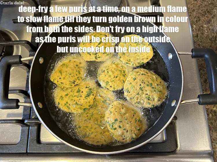 Step 19 – Deep-fry a few puris at a time, on a medium flame to slow flame&nbsp;till they …