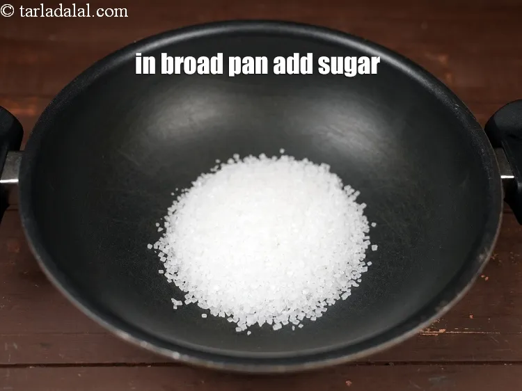 Step 20 – In a broad non-stick pan add &frac12; cup <a href="https://www.tarladalal.com/glossary-sugar-chini-shakkar-278i">sugar</a>.