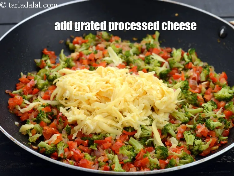 Step 19 – Add 1/2 cup&nbsp;<a href="https://www.tarladalal.com/glossary-grated-processed-cheese-868i">grated processed cheese</a>.