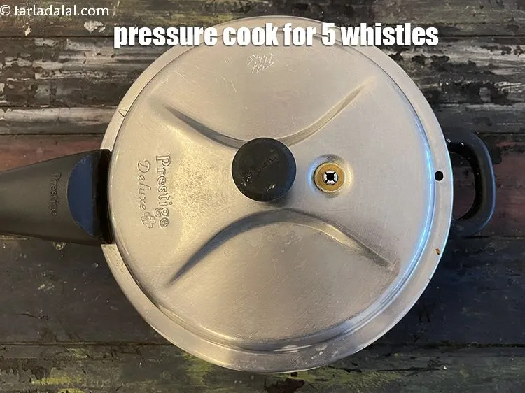 Step 14 – Pressure cook for 5 whistles.&nbsp;Pressure cook for 5&nbsp;whistles.&nbsp;<u><em>Pressure cook it for&nbsp;4 to 5&nbsp;whistles or till …