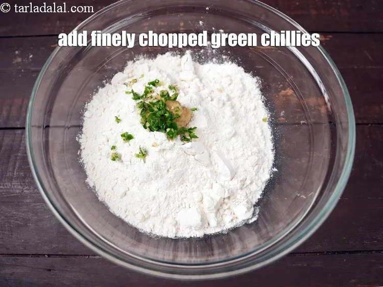 Step 20 – Add 1 tsp finely <a href="https://www.tarladalal.com/glossary-chopped-green-chilli-820i">chopped green chillies</a>.