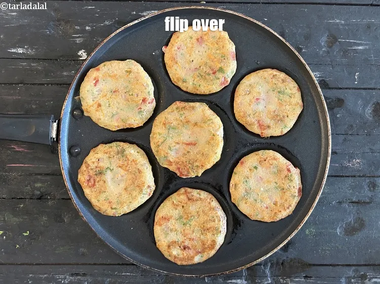 Step 19 – <meta charset="UTF-8" />Flip over the uttpam.&nbsp;<br /> &nbsp;