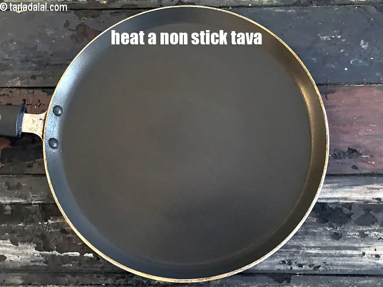 Step 18 – To make <strong>methi pudla recipe | methi chilla | healthy fenugreek pancakes |&nbsp;</strong>heat a non-stick …