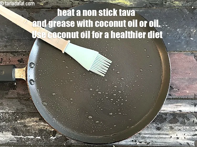 Step 25 – <meta charset="UTF-8" /> Heat a non-stick tava (griddle) , grease it with &frac12; tsp of …