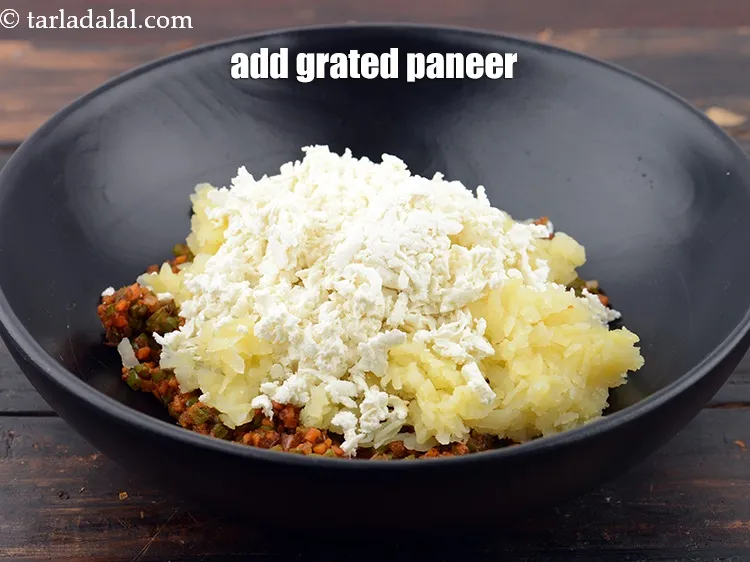 Step 19 – Add 1/2 cup&nbsp;<a href="https://www.tarladalal.com/glossary-grated-panee-1003i">grated paneer (cottage cheese)</a>.