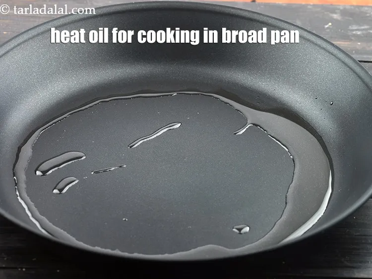Step 21 – Heat 1 tbsp&nbsp;<a href="https://www.tarladalal.com/glossary-oil-671i">oil</a>&nbsp;for cooking in a broad non-stick pan.