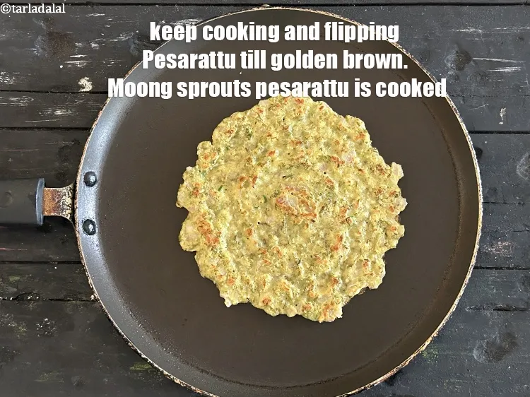 Step 21 – <meta charset="UTF-8" />Keep cooking and flipping Pesarattu till golden brown.&nbsp;Moong Sprouts Pesarattu is cooked.&nbsp;
