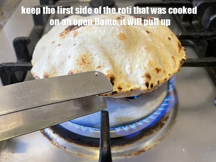 Step 20 – <meta charset="UTF-8" />Lift the&nbsp;<strong>roti</strong>&nbsp;off the tava with a tong and keep the first side that …