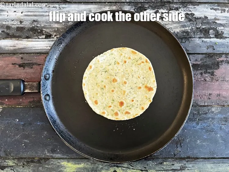 Step 21 – Flip and cook the&nbsp;<strong>Khakhra</strong>&nbsp;on the other side. Cook on slow flame to get a crisp …