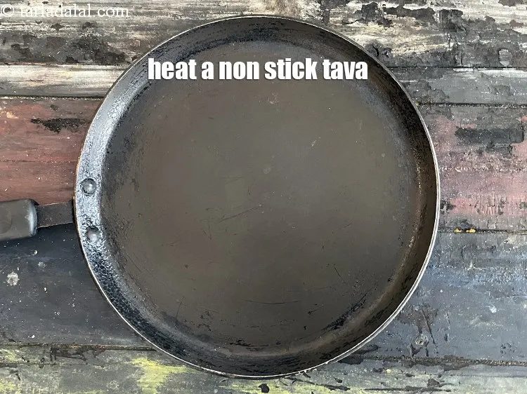 Step 21 – <meta charset="UTF-8" /> Heat a non-stick tava (griddle).