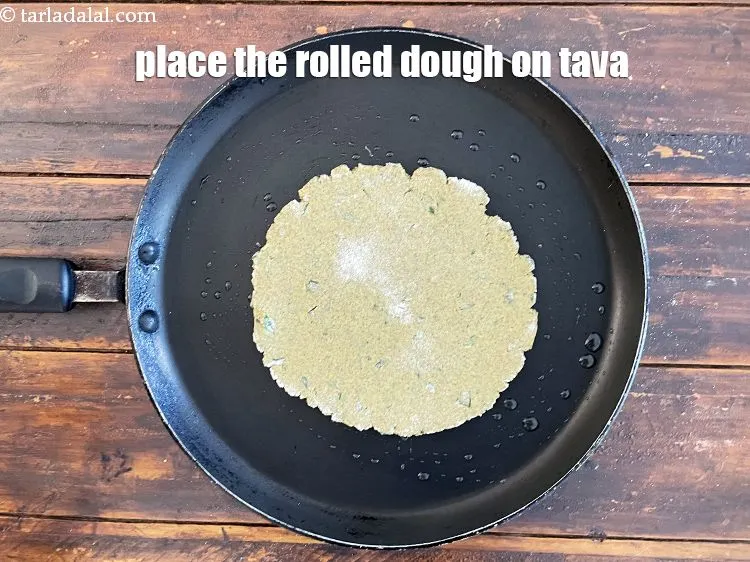 Step 25 – <meta charset="UTF-8" /> Place the rolled out&nbsp;<strong>Khakhra</strong>&nbsp;dough on it.