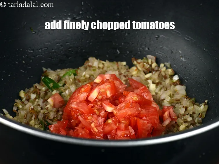 Step 20 – Add &frac12; cup finely&nbsp;<a href="https://www.tarladalal.com/glossary-chopped-tomatoes-779i">chopped tomatoes</a>.