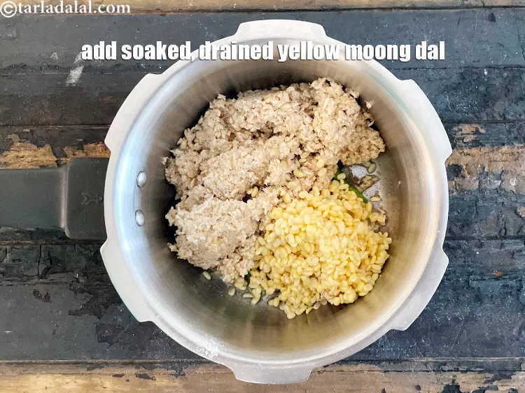 Step 31 – <meta charset="UTF-8" /> Add 1/4 cup&nbsp;<a href="glossary-yellow-moong-dal-split-yellow-gram-peeli-moong-dal-488i">yellow moong dal (split yellow gram)</a>.
