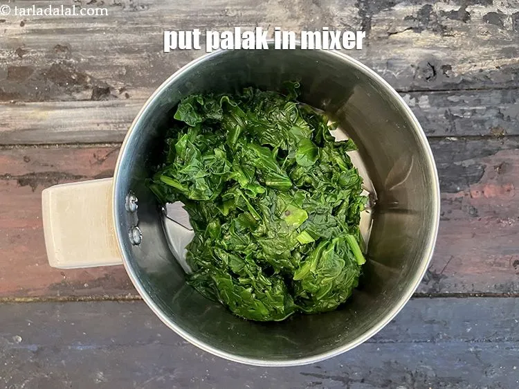 Step 19 – Put palak in a mixer.
