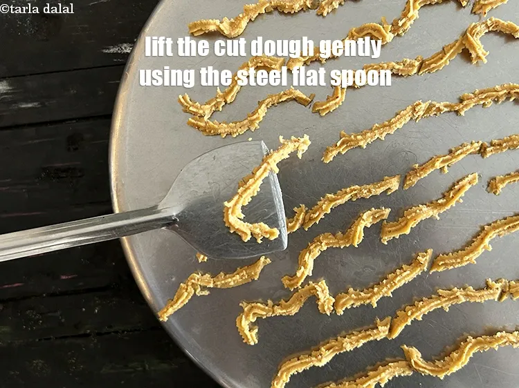 Step 39 – <meta charset="UTF-8" />Lift the cut dough gently using the steel flat spoon.&nbsp;<br /> &nbsp;