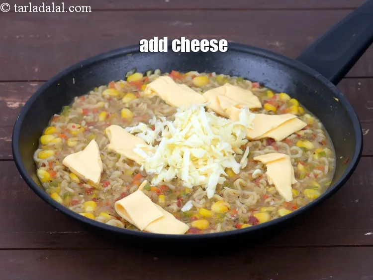 Step 19 – Add 1/4 cup&nbsp;<a href="https://tarladalal.com/glossary-grated-processed-cheese-868i">grated processed cheese</a>.&nbsp;
