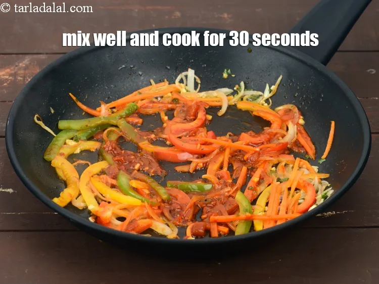 Step 19 – Mix well.&nbsp;Cook on a medium flame for 30 seconds.