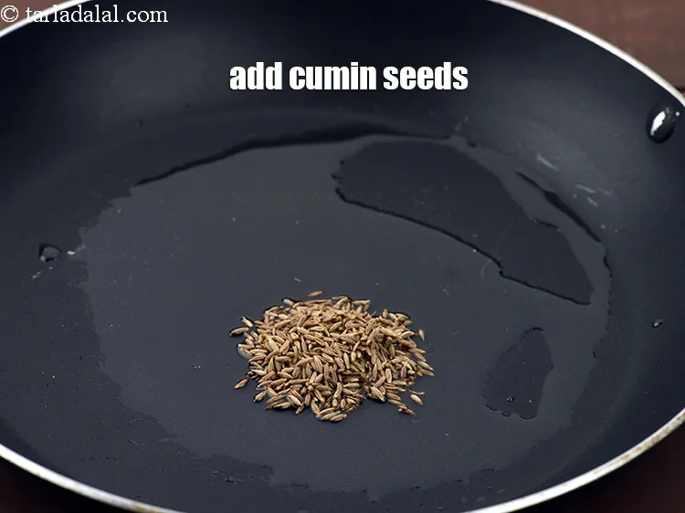 Step 18 – Add 1 tsp <a href="https://www.tarladalal.com/glossary-cumin-seeds-jeera-zeera-381i">cumin seeds (jeera)</a>.