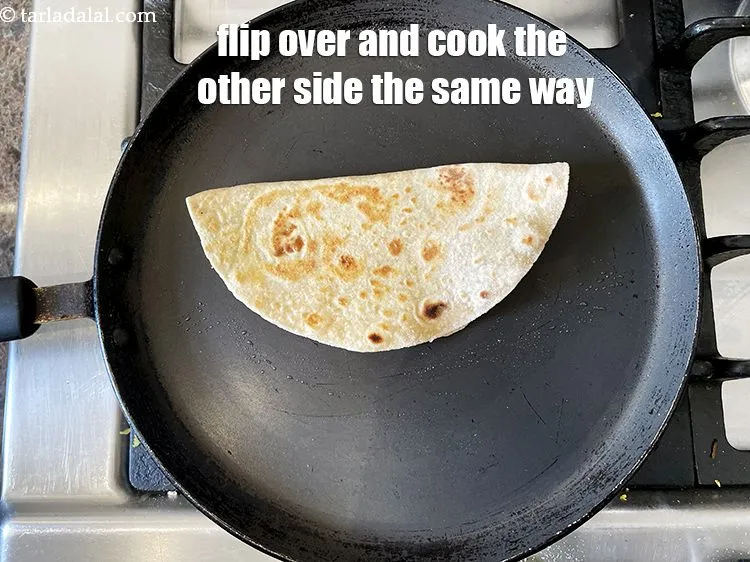 Step 37 – Flip over and cook the other side of the paratha the same way.