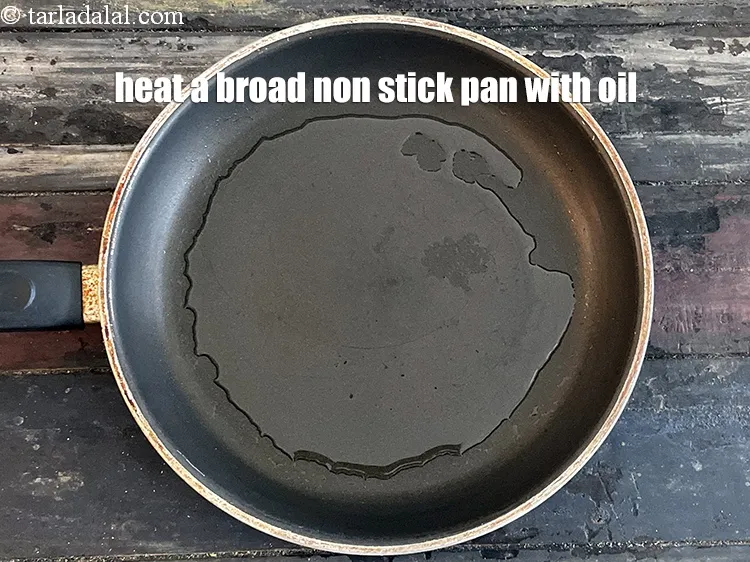 Step 19 – Heat 2 tsp oil in a broad non-stick pan.