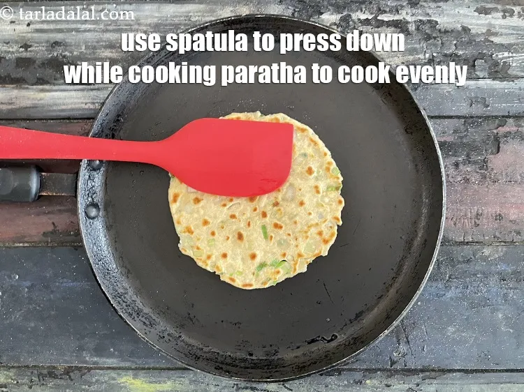 Step 26 – Always use a spaltula and press down while cooking the paratha. This must be done …