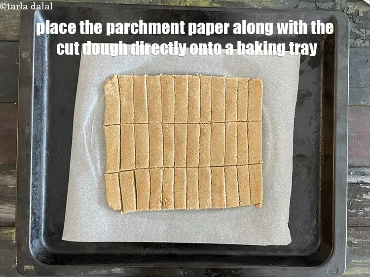 Step 19 – Place the parchment paper along with the shaped dough directly onto a baking tray.&nbsp;