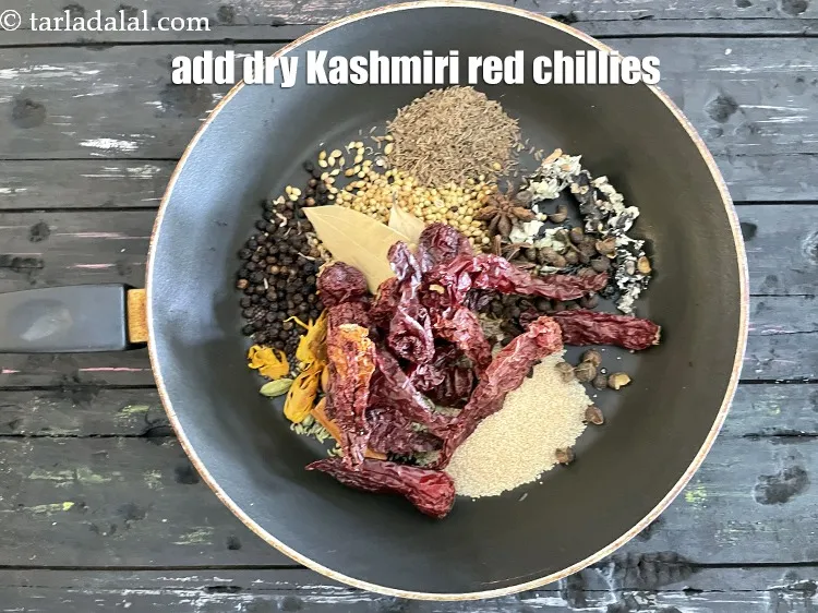 Step 19 – Add&nbsp;<meta charset="UTF-8" />15&nbsp;<a href="glossary-whole-dry-kashmiri-red-chillies-kashmiri-mirch-kashmiri-lal-mirch-332i">whole dry kashmiri red chillies</a>&nbsp;, broken into pieces.