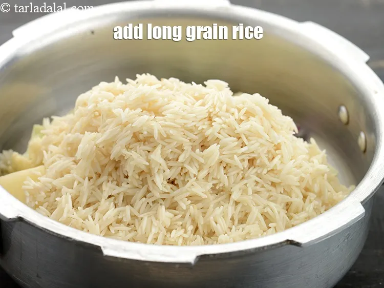 Step 24 – Add 1 1/4 cups&nbsp;<a href="https://www.tarladalal.com/glossary-long-grain-rice-basmati-chawal-basmati-rice-535i">long grain rice (basmati chawal)</a>.