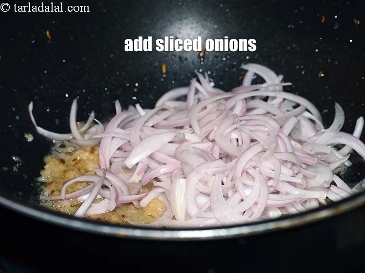 Step 19 – Add &frac34; cup <a href="https://www.tarladalal.com/glossary-sliced-onions-745i">sliced onions</a>.