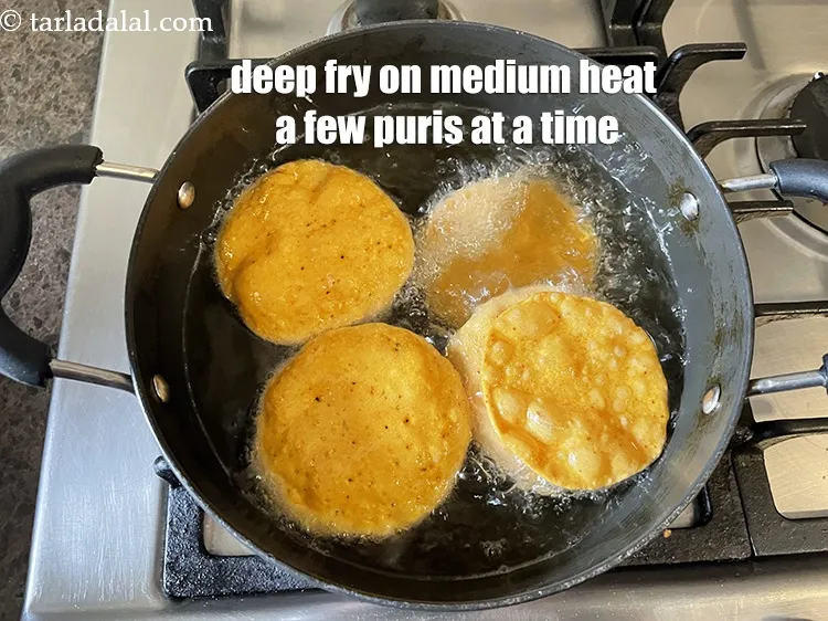 Step 19 – Deep-fry, a few puris at a time, on a medium flame.