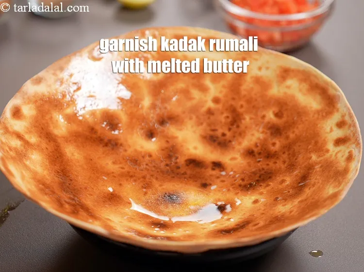 Step 20 – Garnish the kadak rumali roti with melted butter.