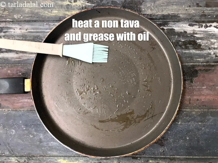 Step 20 – Heat a non-stick tava (griddle) and grease it will little oil.