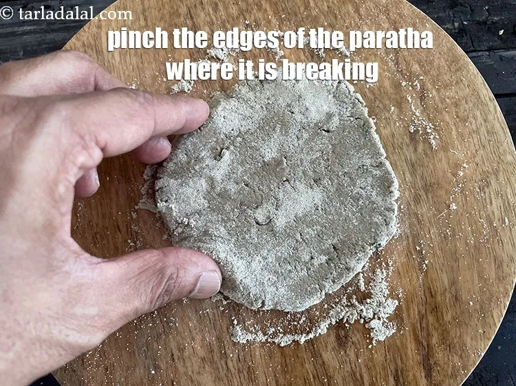 Step 19 – Pinch the edges of the paratha where they are breaking up. Best it to do …