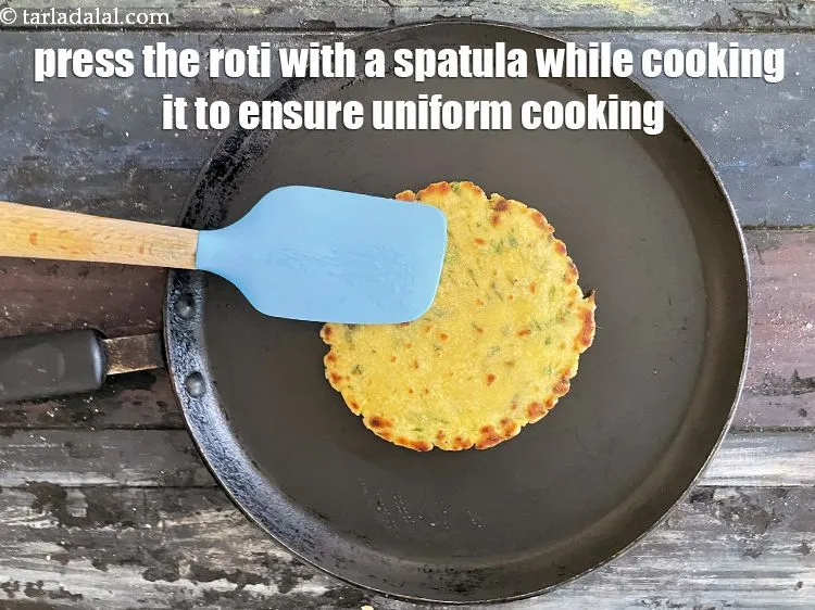 Step 26 – Remember to press the roti down with a spatula while cooking. Press gently all over …