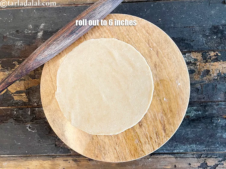 Step 20 – <meta charset="UTF-8" />Roll out each portion into a 150 mm (6&quot;) diameter circle using a …