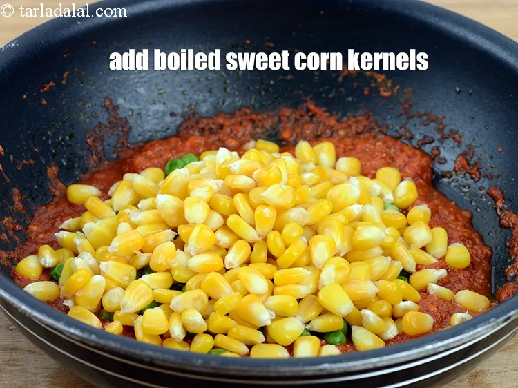 Step 20 – Add 1 &frac14; cups&nbsp;<a href="https://www.tarladalal.com/glossary-boiled-sweet-corn-kernels-153i">boiled sweet corn kernels (makai ke dane)</a>.