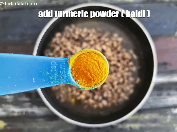 Step 21 – <p>Add&nbsp;1/4 tsp&nbsp;<a href="glossary-turmeric-powder-haldi-645i">turmeric powder (haldi)</a>.</p>