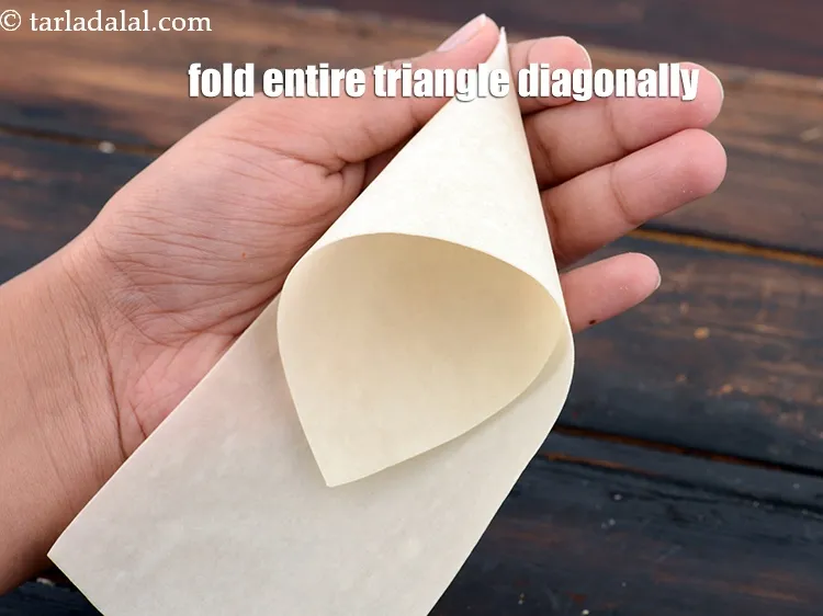 Step 19 – Fold the entire triangle diagonally on the opposite side.