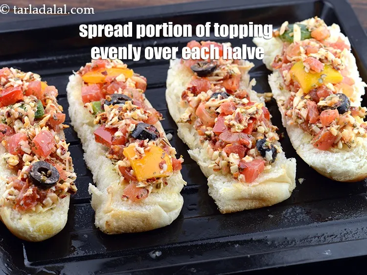 Step 20 – Spread a portion of the herb cheesy tomato topping evenly over each halve.
