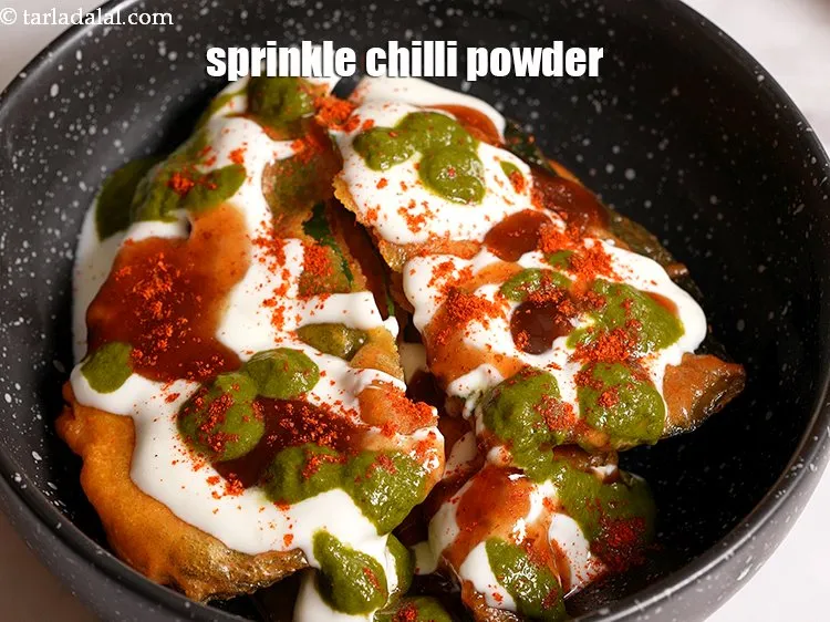 Step 19 – Sprinkle a little <a href="https://tarladalal.com/glossary-chilli-powder-red-chilli-powder-339i">chilli powder</a>.