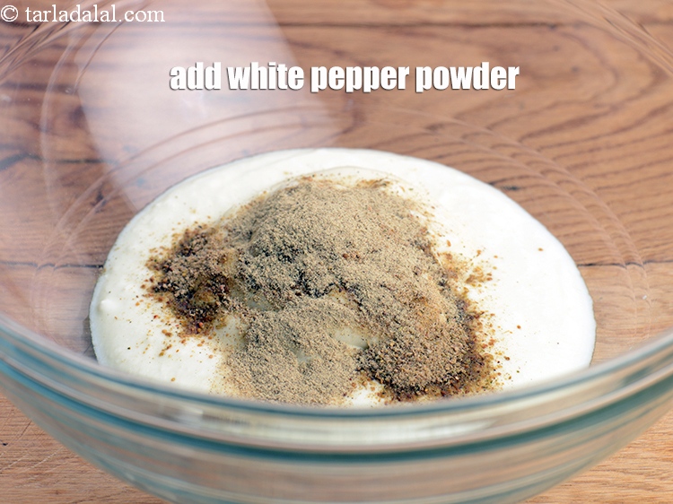 Step 22 – Add &frac12; tsp <a href="https://www.tarladalal.com/glossary-white-pepper-powder-1169i">white pepper powder</a>.&nbsp;