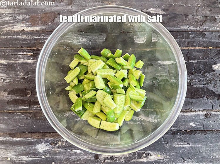Step 12 – Keep aside the tendli marinated in salt in a bowl.