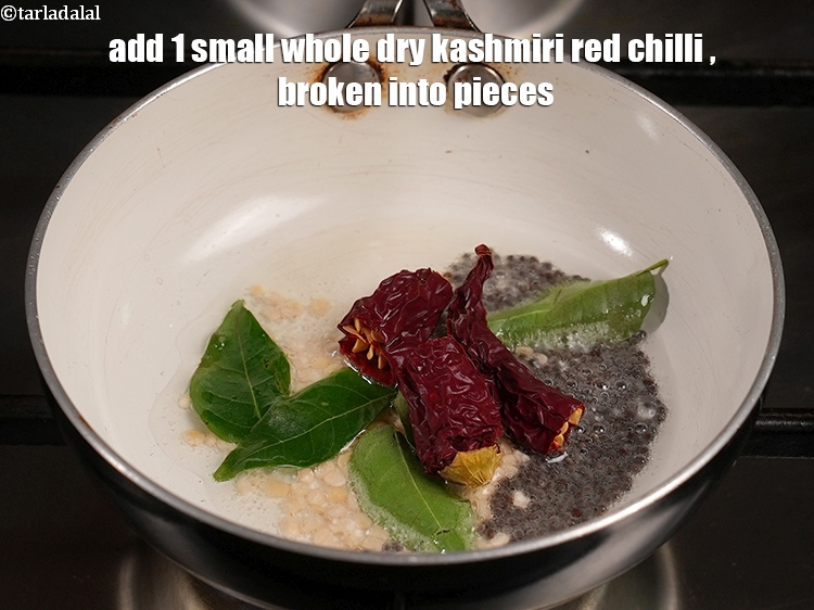 Step 20 – Add&nbsp;<meta charset="UTF-8" />1&nbsp;small&nbsp;<a href="glossary-whole-dry-kashmiri-red-chillies-kashmiri-mirch-kashmiri-lal-mirch-332i">whole dry kashmiri red chilli</a>&nbsp;, broken into pieces.