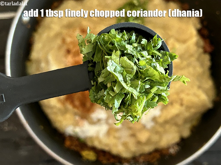Step 26 – Add&nbsp;<meta charset="UTF-8" />1 tbsp&nbsp;finely&nbsp;<a href="glossary-chopped-coriander-783i">chopped coriander (dhania)</a>.